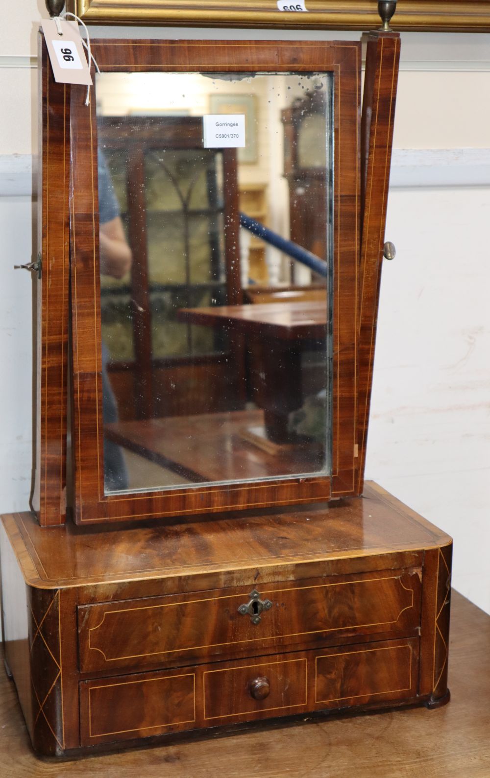 An early 19th century mahogany toilet mirror, W.43cm, D.23cm, H.72cm